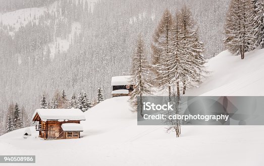 istock Swiss chalets in the snow 940508986