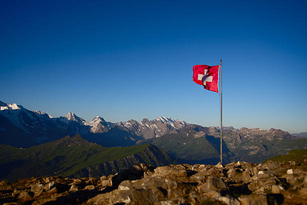Swiss Flag on Top of a Mountain stock photo