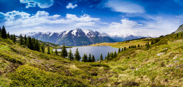 Swiss Mountain Panorama with Bettmersee in front of the Bättlihorn and Fletschhorn stock photo