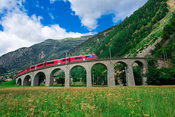 Swiss mountain train Bernina Express Cross the bridge stock photo