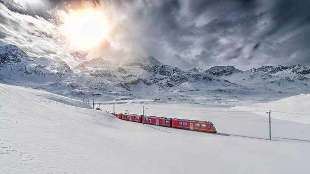 Swiss mountain train Bernina Express crossed through the high mo stock photo
