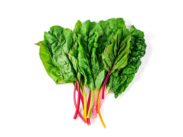 swiss rainbow chard isolated on white Bunch of swiss chard leafves isolated on white background. Fresh swiss rainbow chard with yellow, red and green colors, top view or flat lay chard stock pictures, royalty-free photos & images