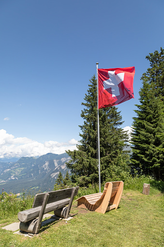 viewpoint with wooden benches on chur's local mountain