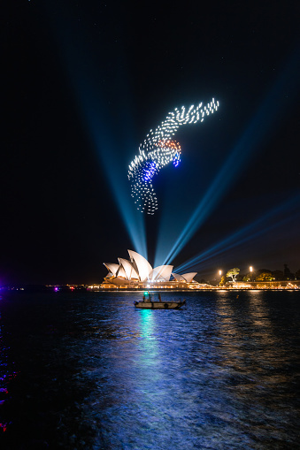 Sydney, Australia - January 2, 2022: A bird shaped drone show on top of Opera House.