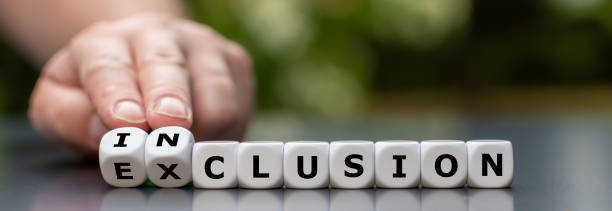 Symbol for a better inclusion. Hand turns dice and changes the word exclusion to inclusion. stock photo