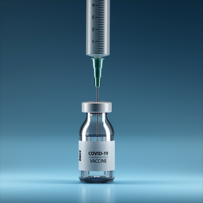 Syringe and Bottle on blue background