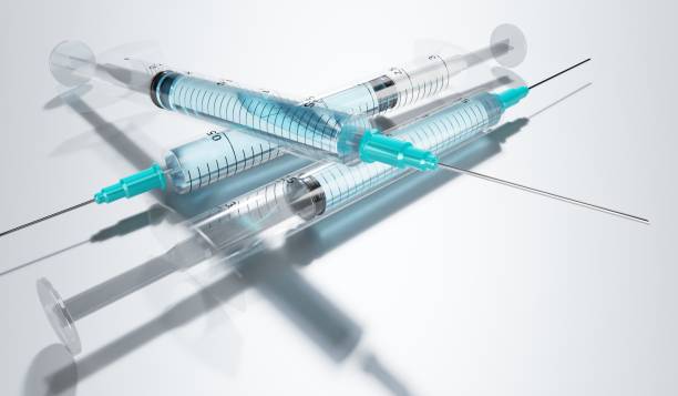 Syringes isolated on grey background - 3D illustration stock photo