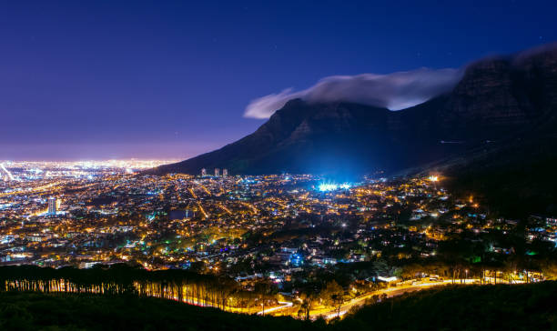 Table Mountain in South Africa at night stock photo