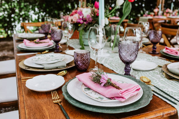 table setup with flowers, glasses and plates on table decorated for Wedding Reception in terrace Latin America stock photo