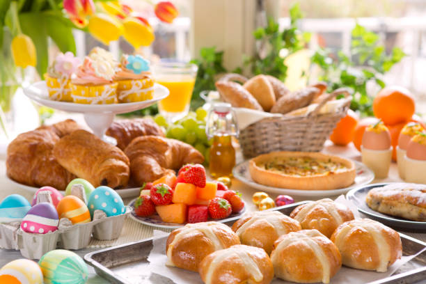 Table with delicatessen ready for Easter brunch Breakfast or brunch table filled with all sorts of delicious delicatessen ready for an Easter meal. savory food stock pictures, royalty-free photos & images