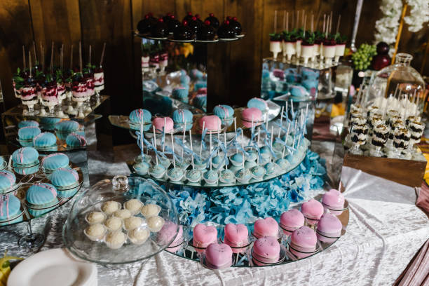 Table with muffins, cakes, sweets, candy, buffet. Dessert table for a party goodies for the wedding banquet area. Close up. candy bar. Decorated delicious. stock photo