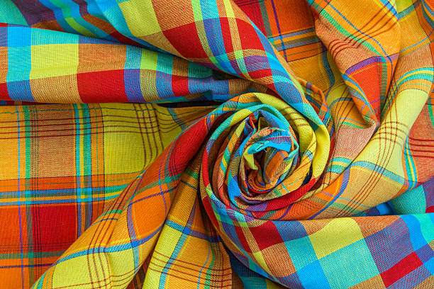 Tablecloths in madras rolled in spiral, tradition of the Caribbean Islands Photo taken indoors on 08/01/2017 at 200 iso, at f 1.3 seconds with the help of a flash and ambient light with macro lens antilles stock pictures, royalty-free photos & images