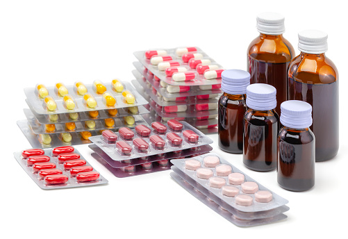 Download Tablet Of Pills And Syrup Medicine Stock Photo - iStock