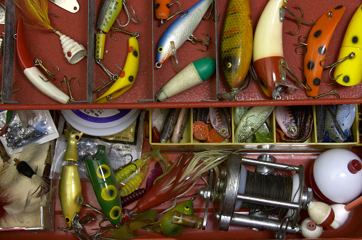 tackle box full of lures, bobbers & more