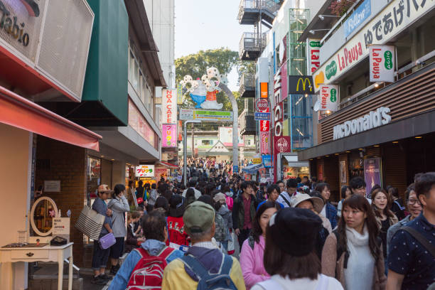 Takeshita Street in Harajuku, Tokyo, Japan People at Takeshita Street in Harajuku, Tokyo, Japan. Takeshita Street is famous tourist attraction in Tokyo. It is a pedestrian-only shopping street and popular amongst young people. mcdonalds japan stock pictures, royalty-free photos & images