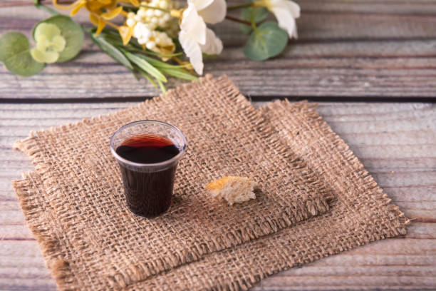 Taking communion concept - the wine and the bread symbols of Jesus Christ blood and body stock photo