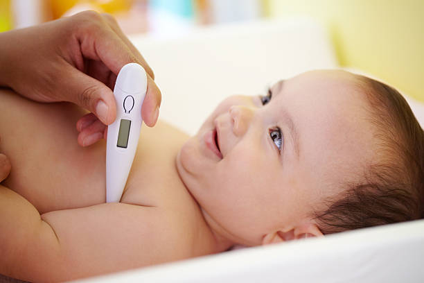 Taking her temperature sick baby stock pictures, royalty-free photos & images