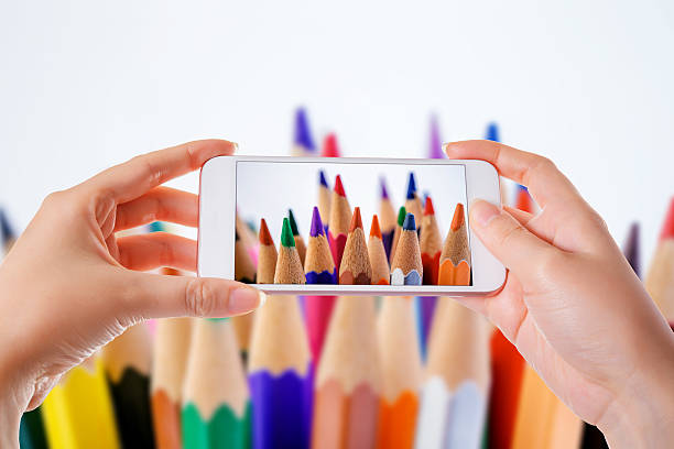 taking photo of color pencils with smart phone - fotografi bild bildbanksfoton och bilder