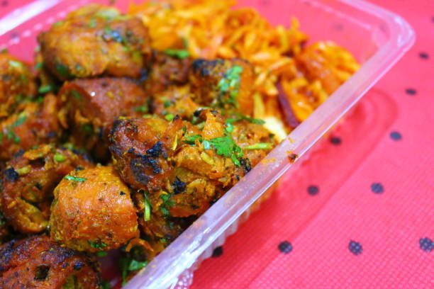 Tandoori soya chaap Tandoori soya chaap in a plastic takeaway box close-up soya bean stock pictures, royalty-free photos & images
