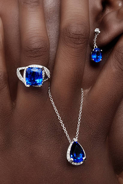Tanzanite and Diamonds Designer Jewellery Tanzanite and Diamonds Designer Jewellery on the Skin of a Black Lady zoisite stock pictures, royalty-free photos & images