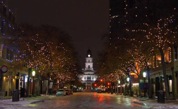 Tarrant County Courthouse at Night after Ice Storm A nighttime view of the Tarrant County Courthouse in Fort Worth, Texas, from the middle of Main Street. The ground is coated in ice due to a rare storm that had previously passed through. snow in texas stock pictures, royalty-free photos & images