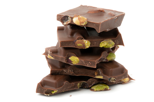 Tasty Chocolate Piece with pistachio isolated on white.