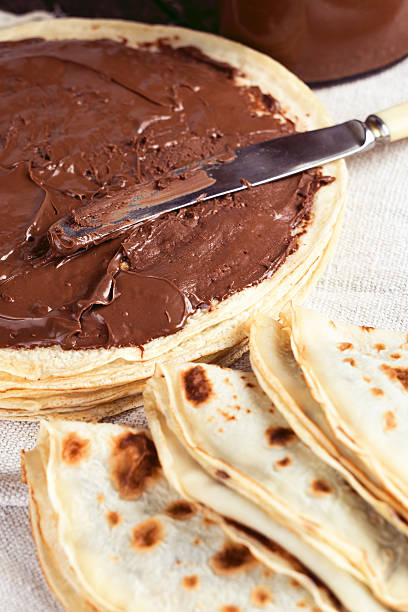 Tasty pancakes with milk chocolate spread nutella stock photo
