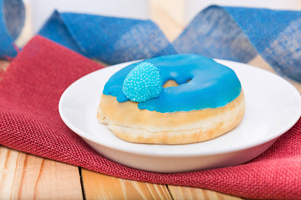 tasty sweets - blue donut stock photo