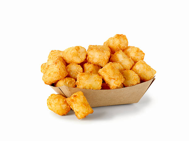 Tater Tots Hash Brown Potatoes in a take out container - Photographed on Hasselblad H3D2-39mb Camera hash brown photos stock pictures, royalty-free photos & images