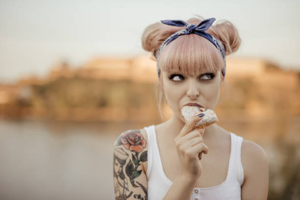 Tattooed girl posing for social media Tattooed girl posing for social media pink hair stock pictures, royalty-free photos & images