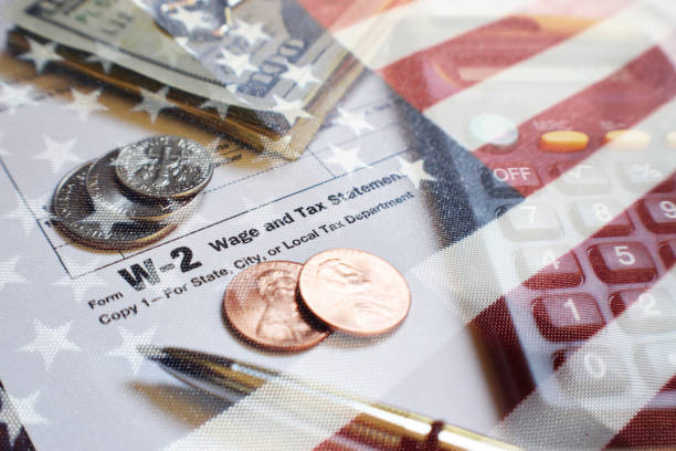 W-2 Tax Form With American Flag, Money, Calculator & Expensive Pen High Quality stock photo