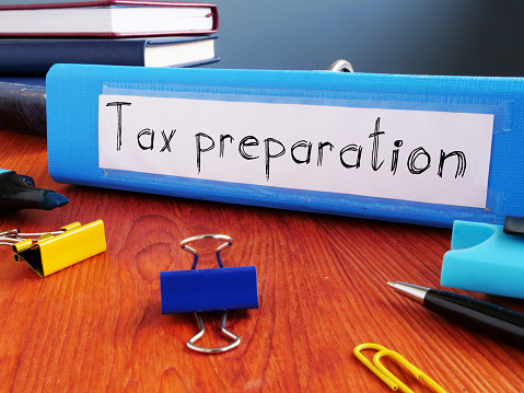 Tax preparation is shown on a business photo using the text