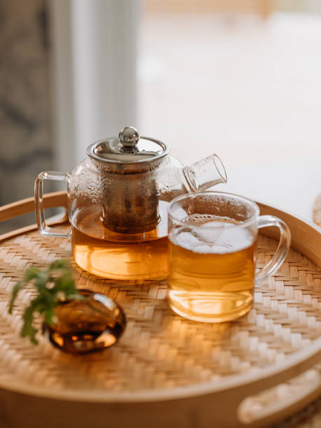 tea ceremony fresh brewed tea in glas cup and teapot stock photo