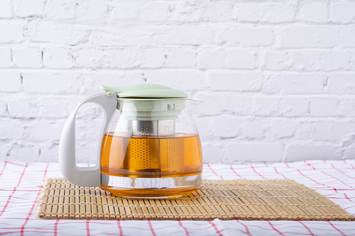 Tea strainer as a teapot for making hot drink.