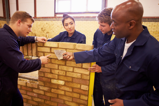 teacher helping students training to be builders picture id511791391?b=1&k=20&m=511791391&s=170667a&w=0&h=Vb7ljmxhNvj i9j2DcJQBwnNNnuJ5qWZcGXKtfqowCc=