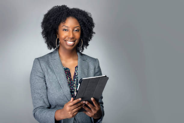 Teacher or Businesswoman with Tablet stock photo