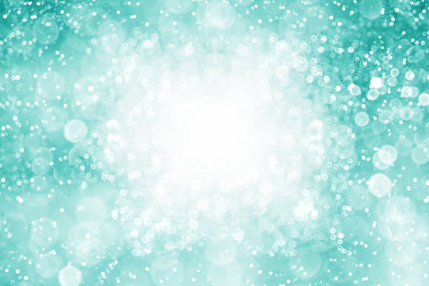 Teal turquoise mint glitter sparkle bokeh celebrate Christmas background stock photo