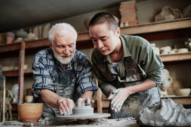 Teamwork on ceramics in studio stock photo