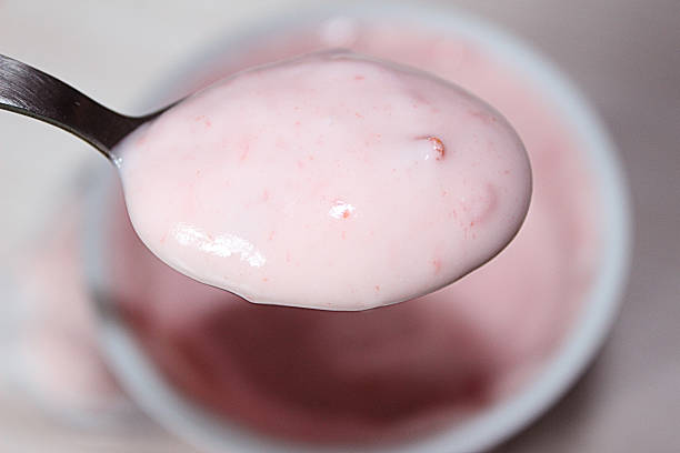 Teaspoon of fruit yoghurt stock photo