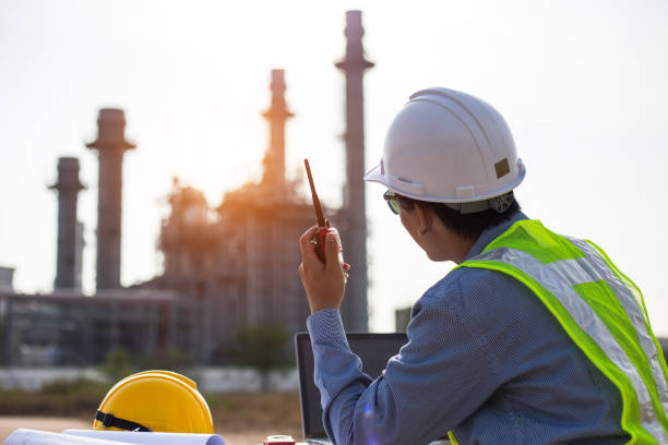 technician Industrial workers with walkie-talkie working in a power plant stock photo