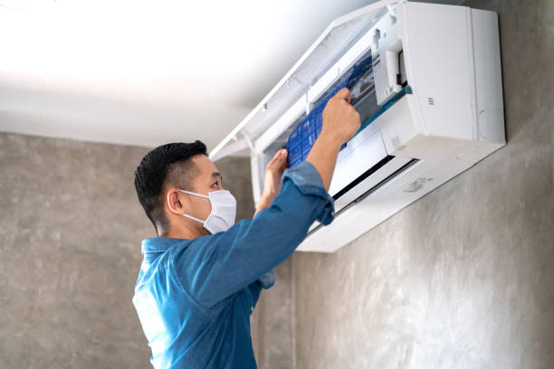 Technician man repairing ,cleaning and maintenance Air conditioner Technician man repairing ,cleaning and maintenance Air conditioner on the wall in bedroom or office room.On site home service,Business ,Industrial concept. ventilation stock pictures, royalty-free photos & images