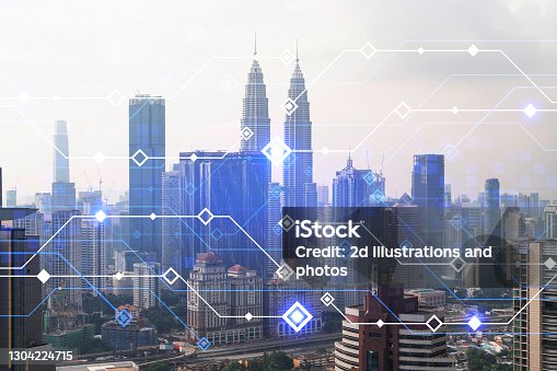 istock Technology hologram over panorama city view of Kuala Lumpur. KL is the largest tech hub in Malaysia, Asia. The concept of developing coding and high-tech science. Double exposure 1304224715