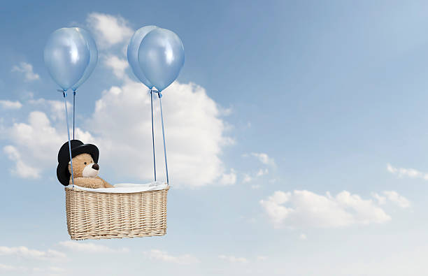 teddy bear in a hot air balloon stock photo