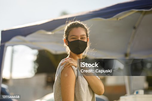 istock Teen girl after her vaccination 1311564458