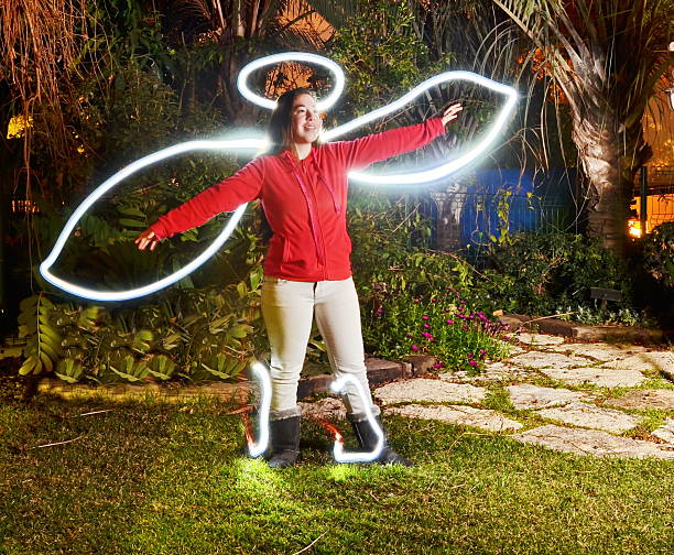 Teenage angel (light painting for Halloween) Teenage angel - light painting (soft focus effect) angel number 12 stock pictures, royalty-free photos & images