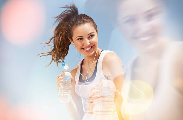 teenage girl drinking water. young teenager drinking water after exercise. hot latino girl stock pictures, royalty-free photos & images