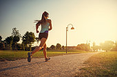 Teenage girl jogging in city park.
Sunny summer day sunset.
Nikon D850