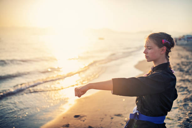 Teenage girl practicing kung fu on beach Teenage girl practicing kung fu on beach
Nikon D850 bushido lifestyle stock pictures, royalty-free photos & images