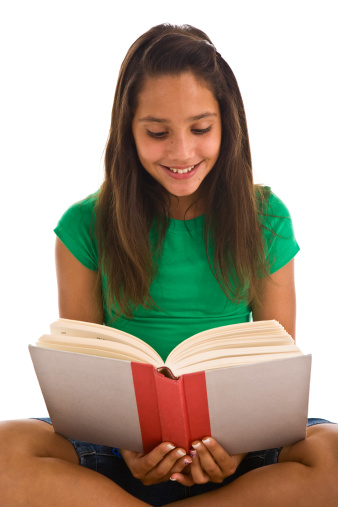 Teenage Girl Sitting Cross Legged Reading A Book Stock Photo - Download ...