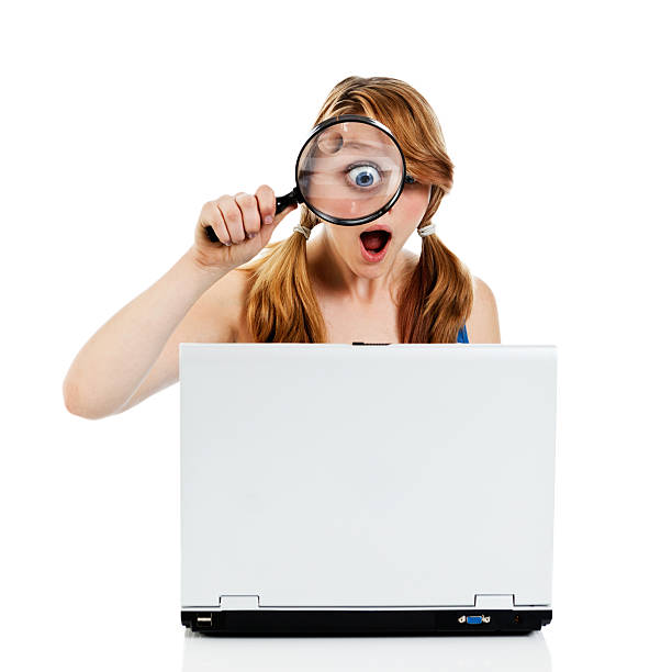 omg! teenage girl with magnifying glass amazed by laptop image - omg girl bildbanksfoton och bilder